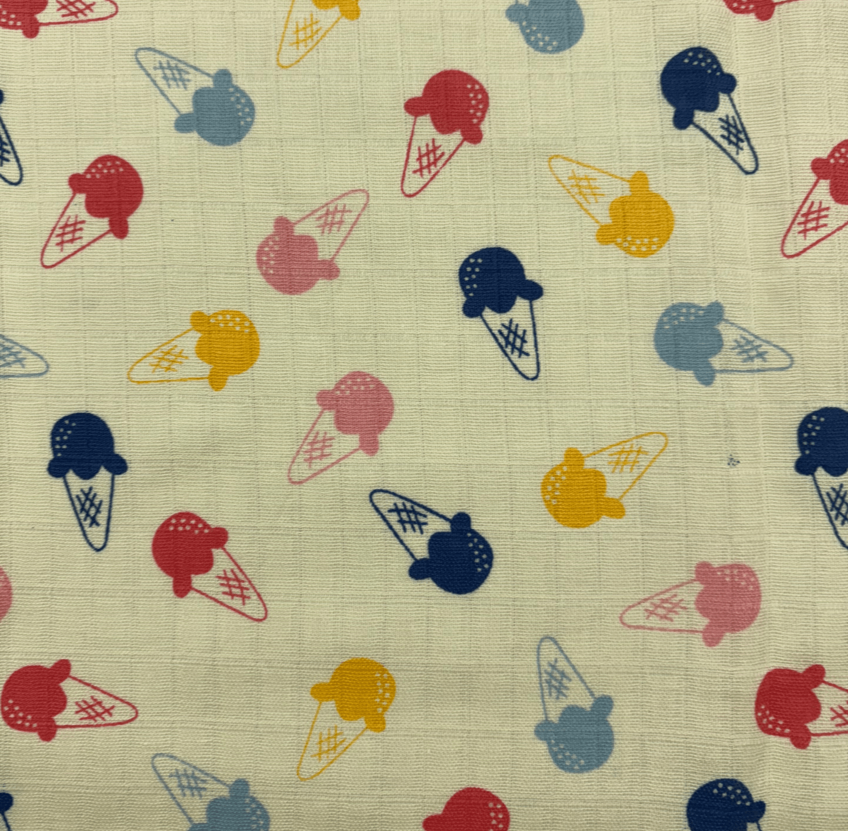 A vibrant selection of printed muslin cloth showcasing floral and geometric patterns, perfect for summer garments and accessories.