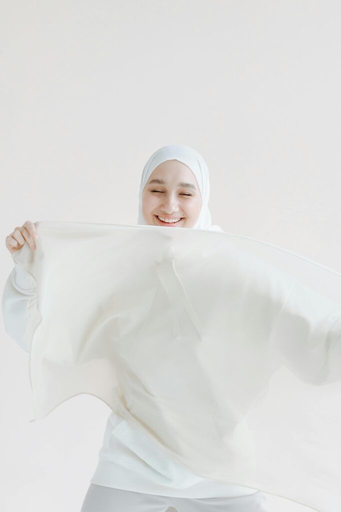 Various muslin fabric items including swaddles, blankets, and clothing, showcasing the versatility and softness of muslin.